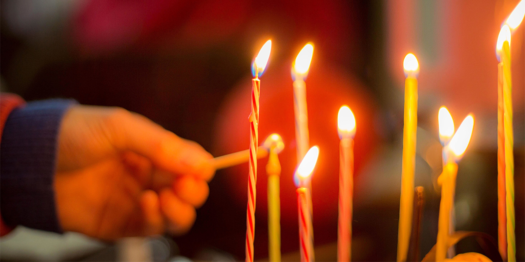 Child Lighting Birthday Cake Candles